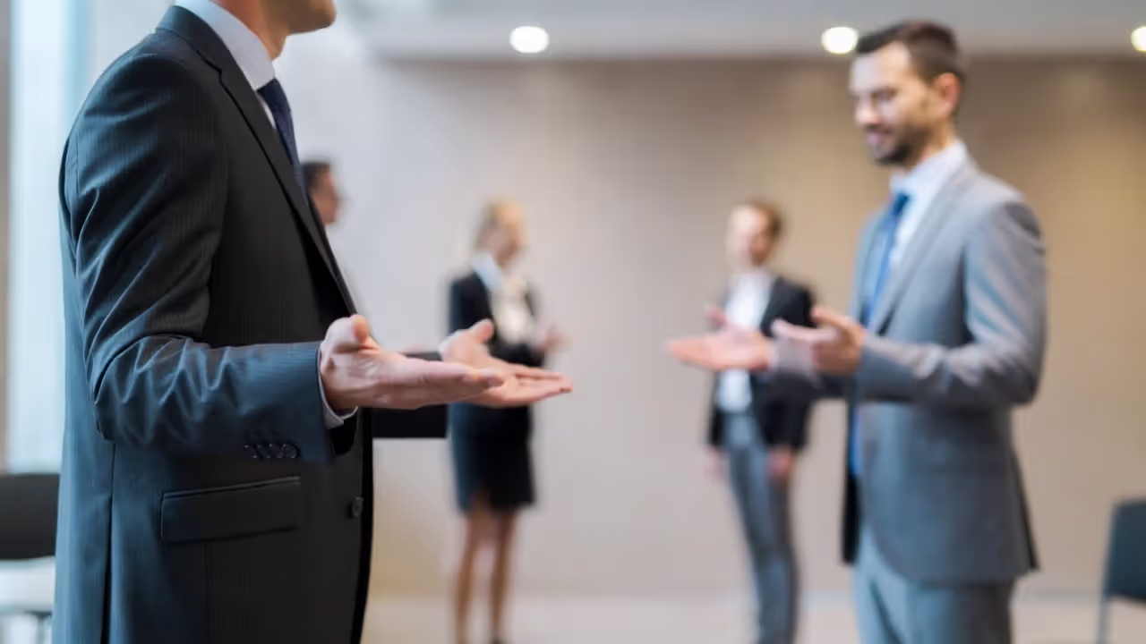 Confident and anxious body language at a professional networking event