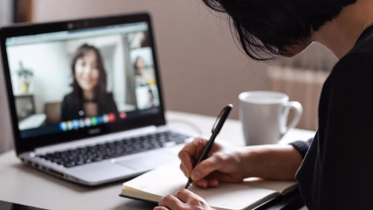 Professional taking notes after a networking community meeting