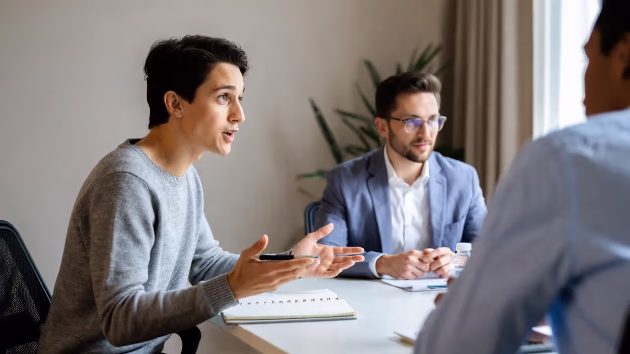 Networking conversation with one attendee distracted by checking a phone