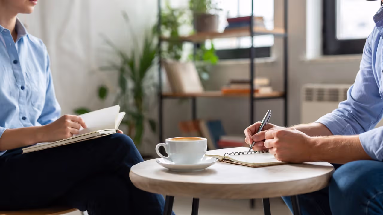 Two professionals having a relaxed one-on-one coffee meeting